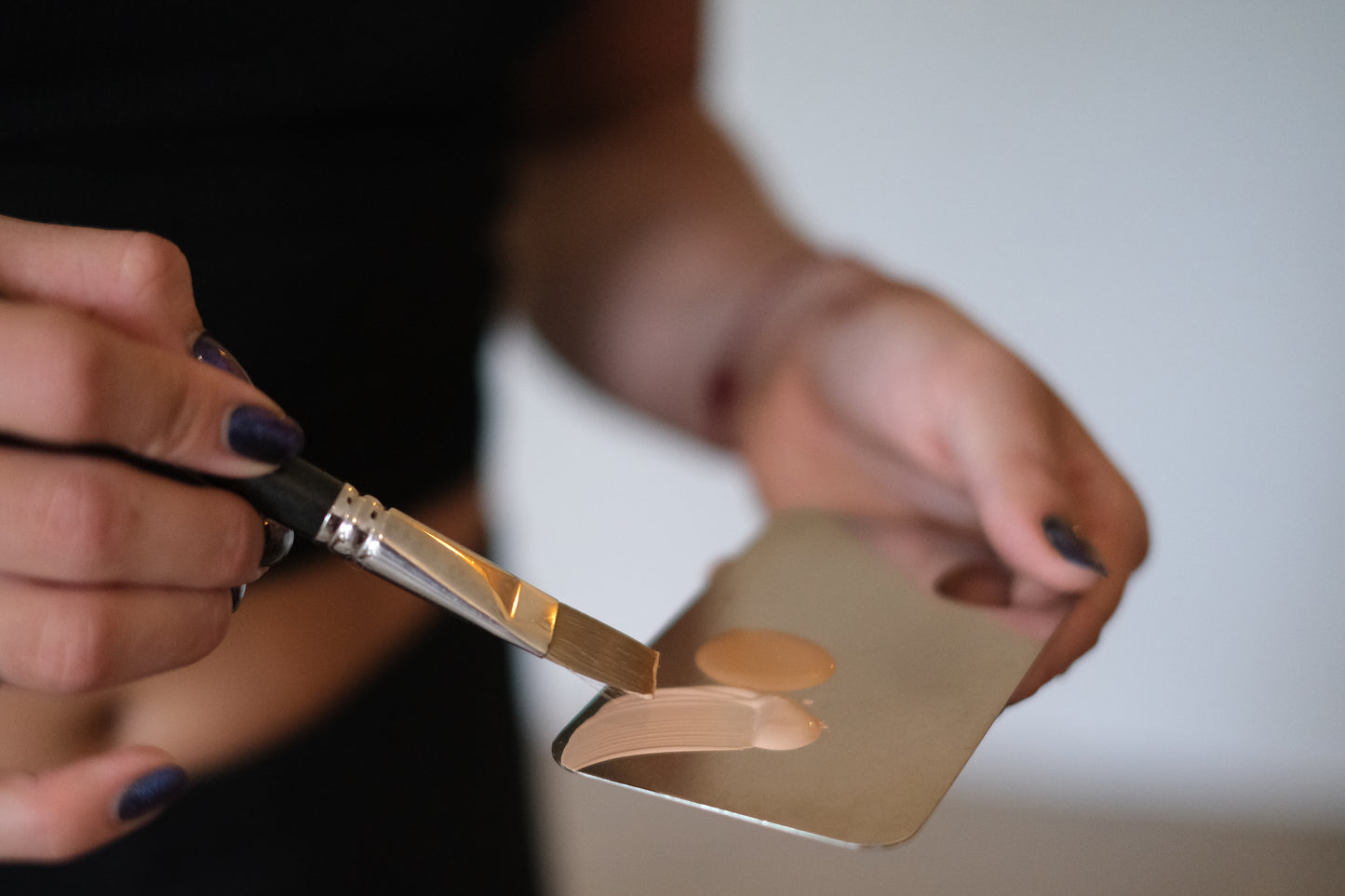 Woman's Hands Mixing Tint Colours